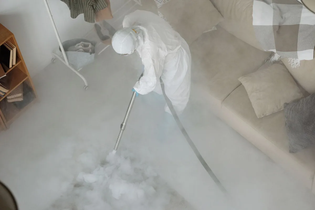 Biohazard cleanup technician in protective equipment, Carlisle, IA
